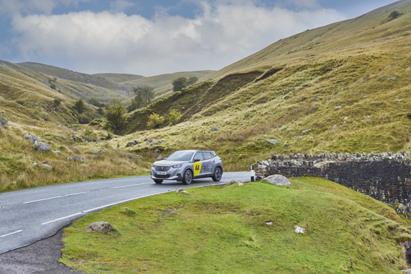 A car driving in a mountain roads